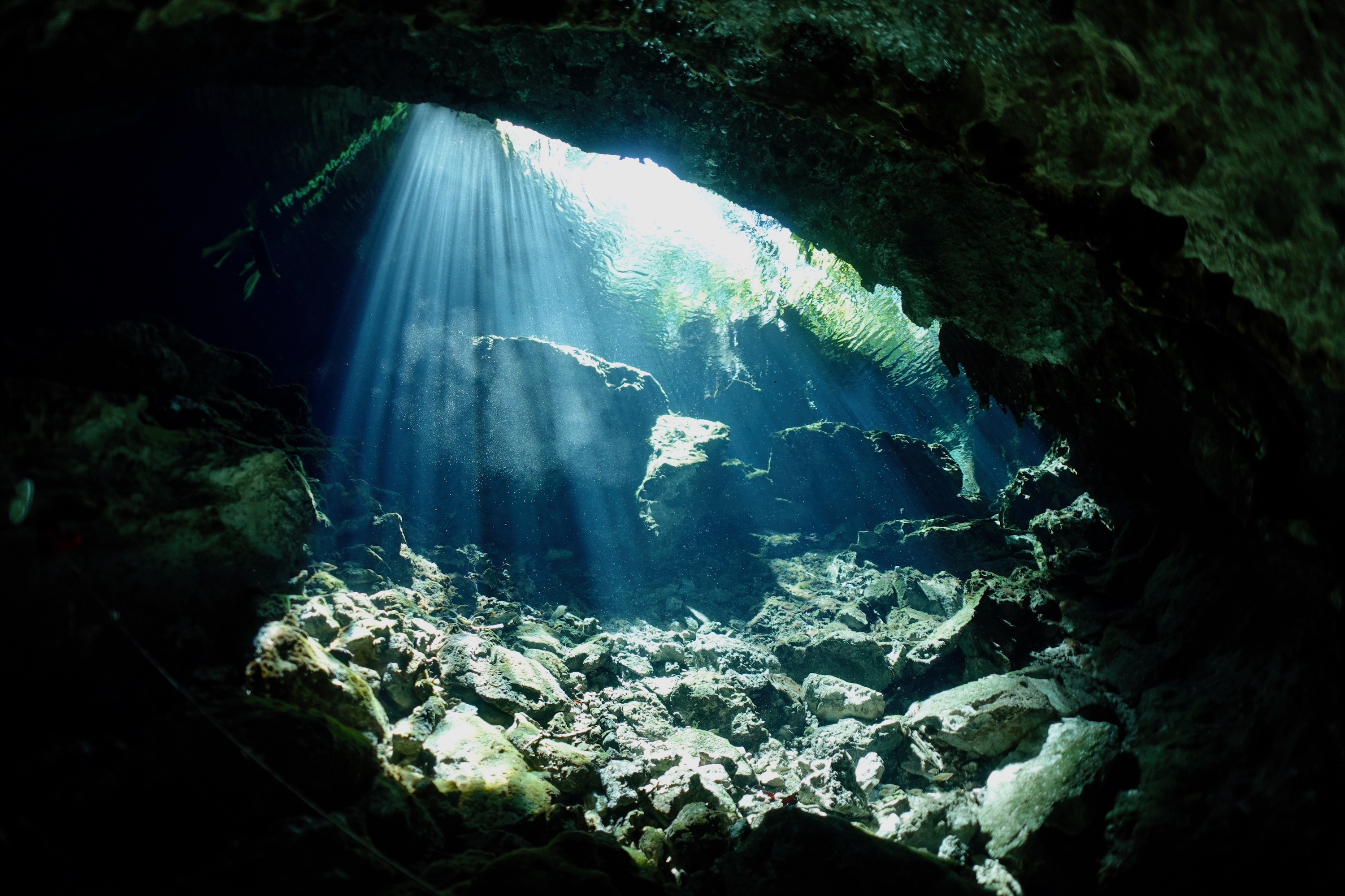 Light beams in Cenote Minotauro. Photo by Pierre Constant