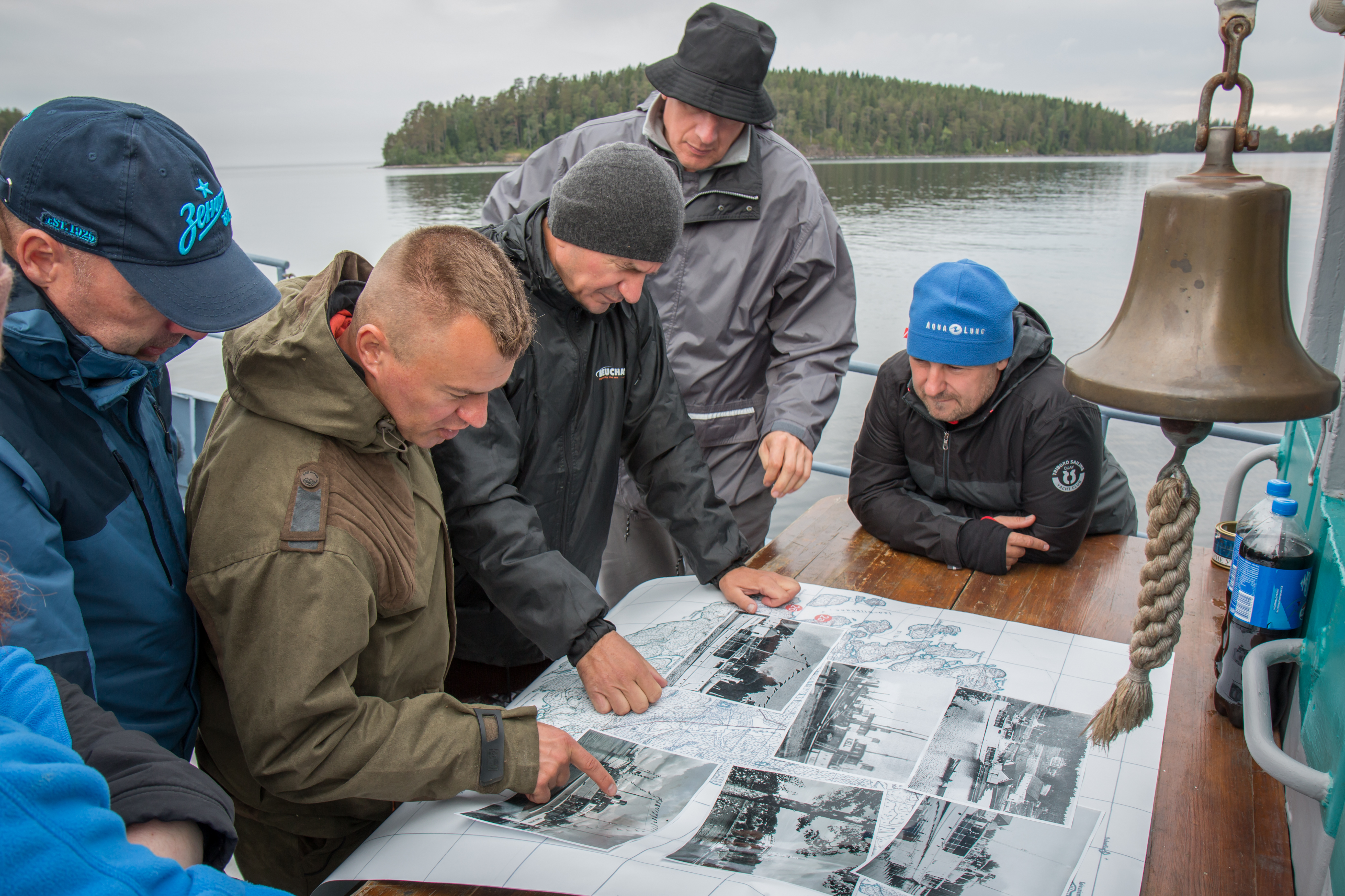 Divers study map, historical documents and photos with views of the Valamon Luostari. Photo by Stanislav Trofimov.