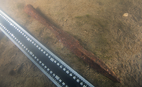 Underwater documentation of the spearhead. Photo by Stanislav Trofimov