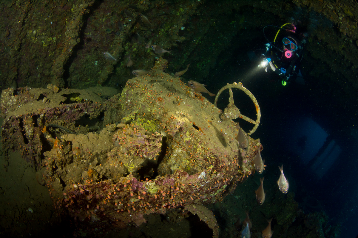 Diver with car in cargo hold of Turkia wreck. Photo by Rudolf Gonda.