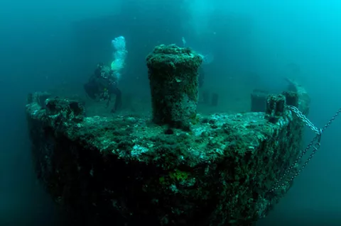 Diver on the bow of the wreck of USS Accokeek located off the coast of Panama City Beach in Florida. Photo courtesy of Florida Department of State.