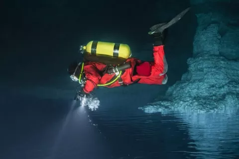 Cave diver in drysuit. Photo by Andrey Bizyukin