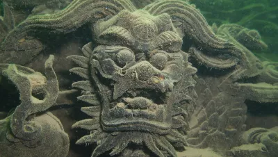 Carving on submerged structure in Qian Doa Lake. Photo by Don Silcock.