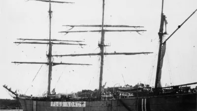 A rare photo of the sailing ship Plus at anchor in a harbour 