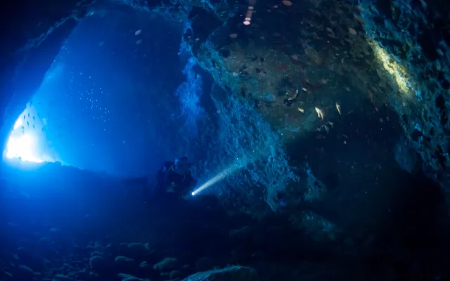 Diver in lava cave