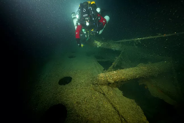 Diver at the davit, or crane, on the wreck of the Lusitania. Photo by Vic Verlinden.