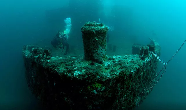 Diver on the bow of the wreck of USS Accokeek located off the coast of Panama City Beach in Florida. Photo courtesy of Florida Department of State.