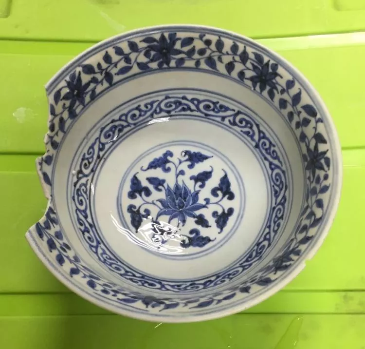 Nearly intact blue-and-white bowl with alternating lotus and scroll decoration from SW1. Photo credit: ISEAS-Yusof Ishak Institute.