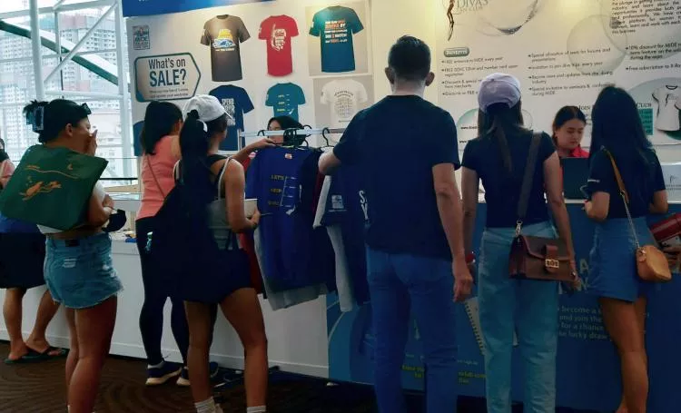 Visitors queue up at the Dive Divas sale. 