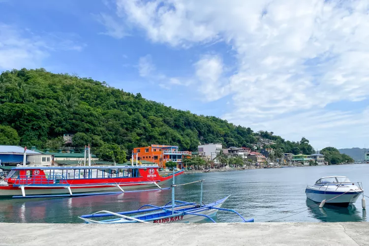 Colourful boats and houses at the promenade of Romblon Town, Romblon Island